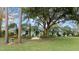 House exterior surrounded by lush landscaping and large trees at 2 Walnut Ct, Ormond Beach, FL 32174