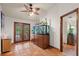 Hallway with tile floors, large fish tank, and access to backyard at 2 Walnut Ct, Ormond Beach, FL 32174