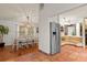 Open kitchen with island, breakfast nook and view of dining room at 2 Walnut Ct, Ormond Beach, FL 32174