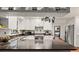 Kitchen boasts granite countertops and white cabinets at 2 Walnut Ct, Ormond Beach, FL 32174