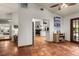 View of living room and kitchen from entryway, showcasing tile floors at 2 Walnut Ct, Ormond Beach, FL 32174
