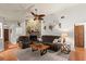 Relaxing living room with stone fireplace and hardwood floors at 2 Walnut Ct, Ormond Beach, FL 32174