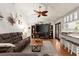 Open living room boasts hardwood floors and ceiling fan at 2 Walnut Ct, Ormond Beach, FL 32174