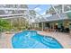 Inviting screened-in pool and spa area at 2 Walnut Ct, Ormond Beach, FL 32174
