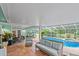 Relaxing poolside patio with tiled floor and seating at 2 Walnut Ct, Ormond Beach, FL 32174
