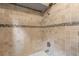 Tiled shower with neutral tones at 2 Walnut Ct, Ormond Beach, FL 32174