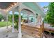 Wooden steps leading to a porch with white columns at 2 Walnut Ct, Ormond Beach, FL 32174