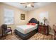 Cozy bedroom with comfortable seating and decor at 209 Wellington Woods Ave, Deland, FL 32724