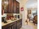 Charming breakfast nook with built-in coffee bar and granite counters at 209 Wellington Woods Ave, Deland, FL 32724