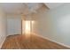 Bright bedroom with wood floors and double doors leading to a spacious closet at 22 Old Macon Dr, Ormond Beach, FL 32174