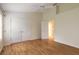 Well-lit bedroom, featuring hardwood floors and double door closet at 22 Old Macon Dr, Ormond Beach, FL 32174