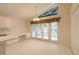 Bright breakfast room featuring built-in cabinetry and access to a patio at 22 Old Macon Dr, Ormond Beach, FL 32174