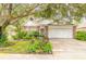 Brick ranch home with mature landscaping and attached garage at 22 Old Macon Dr, Ormond Beach, FL 32174