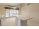 Kitchen features white cabinets, island and access to backyard at 22 Old Macon Dr, Ormond Beach, FL 32174