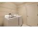 Laundry room with shelving and washer and dryer included at 22 Old Macon Dr, Ormond Beach, FL 32174