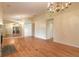 Bright living room featuring hardwood floors, fireplace and chandelier at 22 Old Macon Dr, Ormond Beach, FL 32174