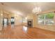 Living room with hardwood floors, fireplace and two chandeliers at 22 Old Macon Dr, Ormond Beach, FL 32174