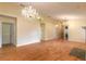 Large living area with hardwood floors and multiple chandeliers at 22 Old Macon Dr, Ormond Beach, FL 32174