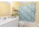 Bathroom with shower/tub and fish-themed curtain at 225 N Hill Ave # 60, Deland, FL 32724