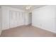 Bedroom with double door closet and carpet at 225 N Hill Ave # 60, Deland, FL 32724