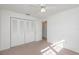 Bedroom with double door closet and carpet at 225 N Hill Ave # 60, Deland, FL 32724