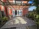 Private patio with brick wall and wooden pergola at 2250 S Palmetto Ave # 180, Daytona Beach, FL 32119