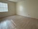 Spacious bedroom with wood-look laminate flooring and ample natural light at 266 E Constance Rd, Debary, FL 32713