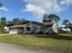 One-story house with attached garage and large front lawn at 266 E Constance Rd, Debary, FL 32713