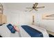 Bedroom with queen bed, window, and sliding door to bathroom at 2928 Bristol Ln, South Daytona, FL 32119