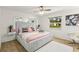 Main bedroom with a plush bed and large window providing natural light at 2928 Bristol Ln, South Daytona, FL 32119