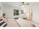 Spacious bedroom with en-suite bathroom access and ceiling fan at 2928 Bristol Ln, South Daytona, FL 32119