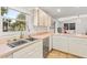 Modern kitchen with a large sink and stainless steel dishwasher at 2928 Bristol Ln, South Daytona, FL 32119