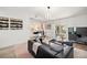 Open living room with kitchen views and access to patio at 2928 Bristol Ln, South Daytona, FL 32119