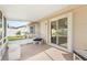 Screened porch with sliding glass doors and seating at 2928 Bristol Ln, South Daytona, FL 32119