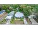 Elevated view of the home's front exterior, landscaping, carport, and street view at 331 Sheldon St, New Smyrna Beach, FL 32168