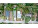 Aerial view showcasing the property's lot lines, surrounding trees, and neighboring homes at 331 Sheldon St, New Smyrna Beach, FL 32168