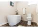 Modern bathroom featuring a sleek soaking tub, toilet, and contemporary fixtures at 331 Sheldon St, New Smyrna Beach, FL 32168