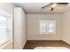 Bedroom with ample natural light, built-in wardrobes, and wood-look flooring at 331 Sheldon St, New Smyrna Beach, FL 32168