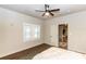 View of the bedroom showcasing wood floors, white walls, and access to another room at 331 Sheldon St, New Smyrna Beach, FL 32168