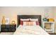Close-up of a bedroom featuring a bed with decorative pillows and a bedside table at 331 Sheldon St, New Smyrna Beach, FL 32168