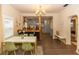 Dining room with a stylish table, chairs, and a view of the kitchen at 331 Sheldon St, New Smyrna Beach, FL 32168