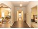 Hallway with wood-look flooring, arched doorways, and views into other rooms at 331 Sheldon St, New Smyrna Beach, FL 32168