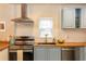 Modern kitchen featuring stainless steel appliances, a stylish faucet, and butcher block counters at 331 Sheldon St, New Smyrna Beach, FL 32168
