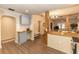 View of the kitchen and adjacent living area with unique wooden support beams at 331 Sheldon St, New Smyrna Beach, FL 32168