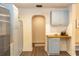 Kitchen with blue cabinets, wood countertops, and a small arched doorway at 331 Sheldon St, New Smyrna Beach, FL 32168