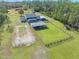 Aerial view of house, pool, and expansive backyard at 3782 Pine Cone Ln, Ormond Beach, FL 32174
