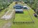 Aerial view of house, pool, and fenced area at 3782 Pine Cone Ln, Ormond Beach, FL 32174
