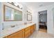 Clean bathroom with double vanity and updated light fixtures at 3782 Pine Cone Ln, Ormond Beach, FL 32174