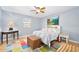 Comfortable bedroom with a king-size bed and colorful rug at 3782 Pine Cone Ln, Ormond Beach, FL 32174