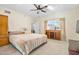 Spacious bedroom with large bed, dresser, and ample closet space at 3782 Pine Cone Ln, Ormond Beach, FL 32174